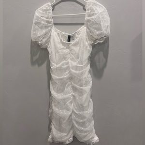 White dot mesh mini dress with short puff sleeves